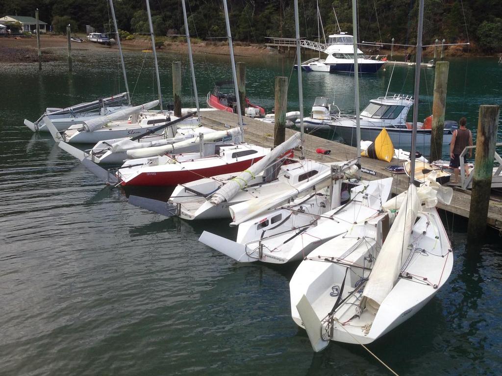 Some of the E5.9 fleet at the jetty at Lidgard House, alongside now Kawau Boating Club  - NZ E5.9 Assn Kawau Weekend 2014 © Elliott 5.9 Association Media